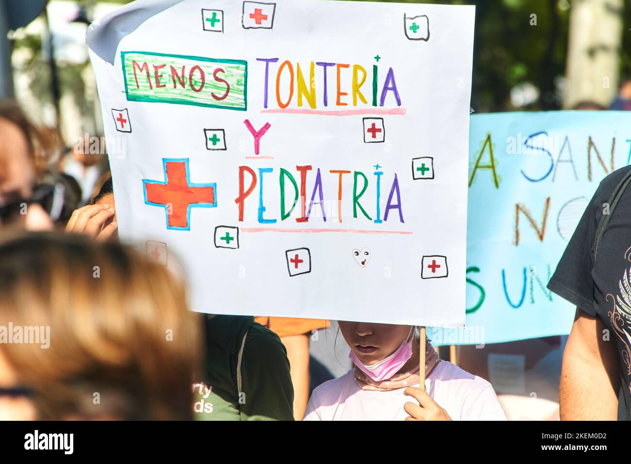 young children protesting in favor of public health on public demonstration with a banner with text 'less nonsense and more pediatrics' on 13th nov 22 Stock Photo