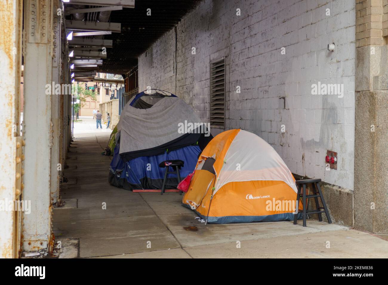 Homeless encampment under railroad viaduct, Milwaukee Avenue. Chicago, Illinois near Fulton Market. Stock Photo