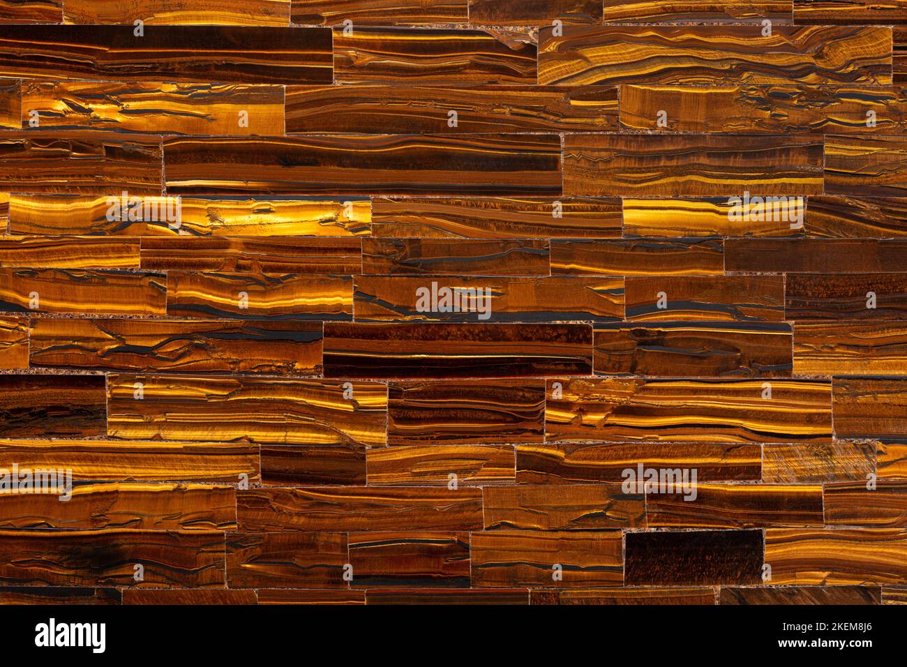 Tiger Eye Golden. Semi precious mineral pattern. Polished semiprecious stone for ceramic wall and floor digital tiles. Material for unique interior Stock Photo
