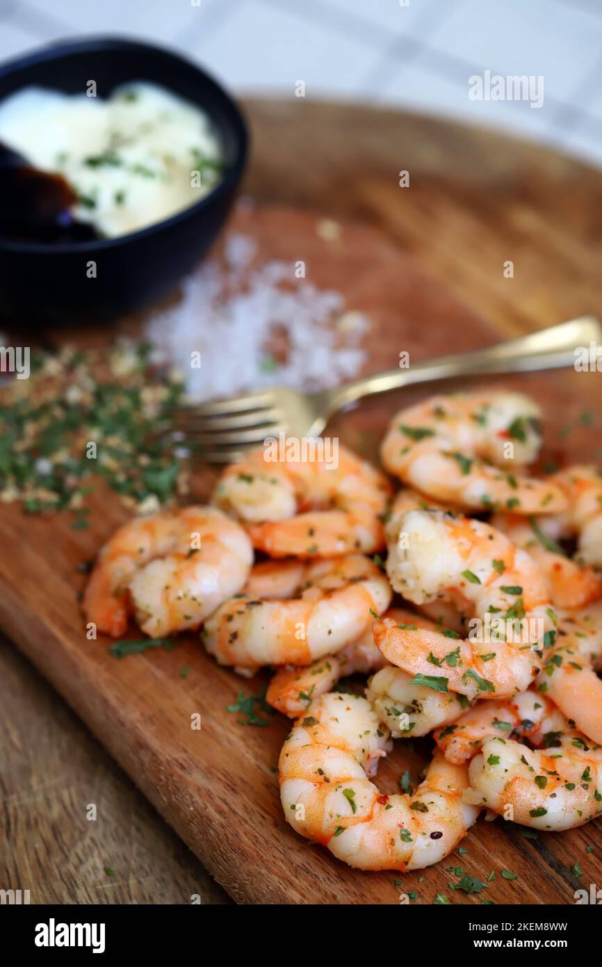 Fresh juicy fried shrimp with spices, garlic and sea salt. Stock Photo
