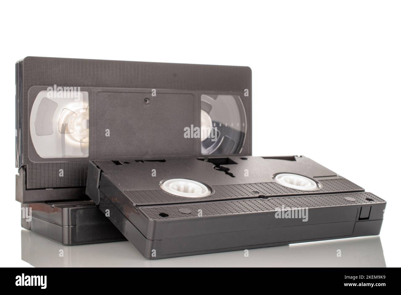 Three video cassettes, macro, isolated on white background Stock Photo