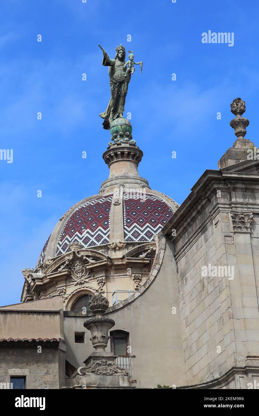 BARCELONA, SPAIN - MAY 10, 2017: This is a mosaic ceramic dome of the Basilica de la Merce with the huge statue of the Virgin Mary. Stock Photo