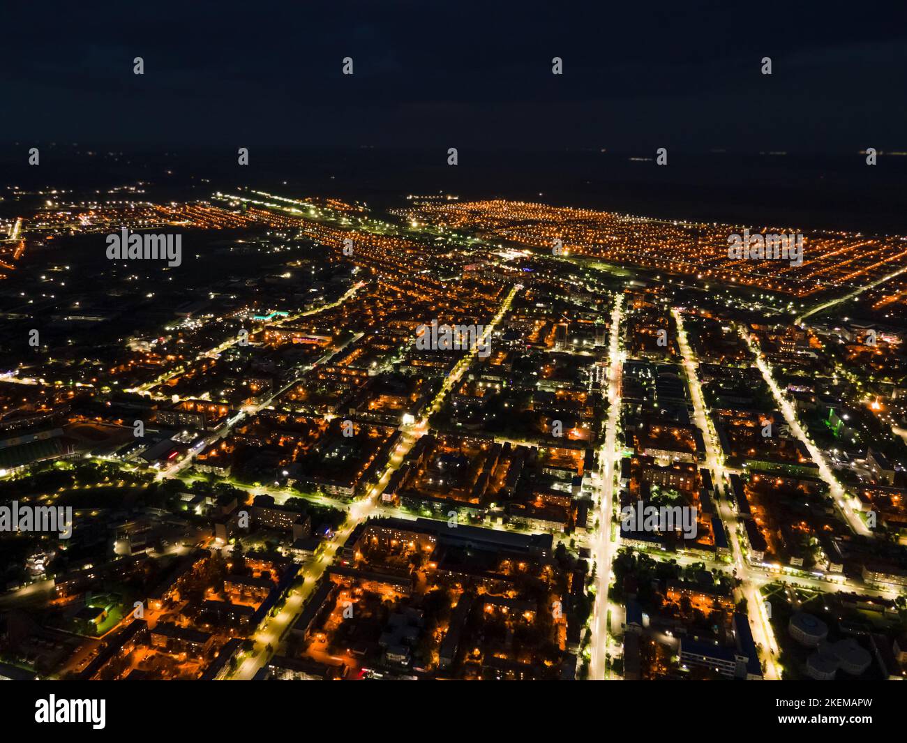 The nightlife of the city,the light of the night city from a height.Busy car traffic on city streets at night.Urban areas and the intersection of stre Stock Photo