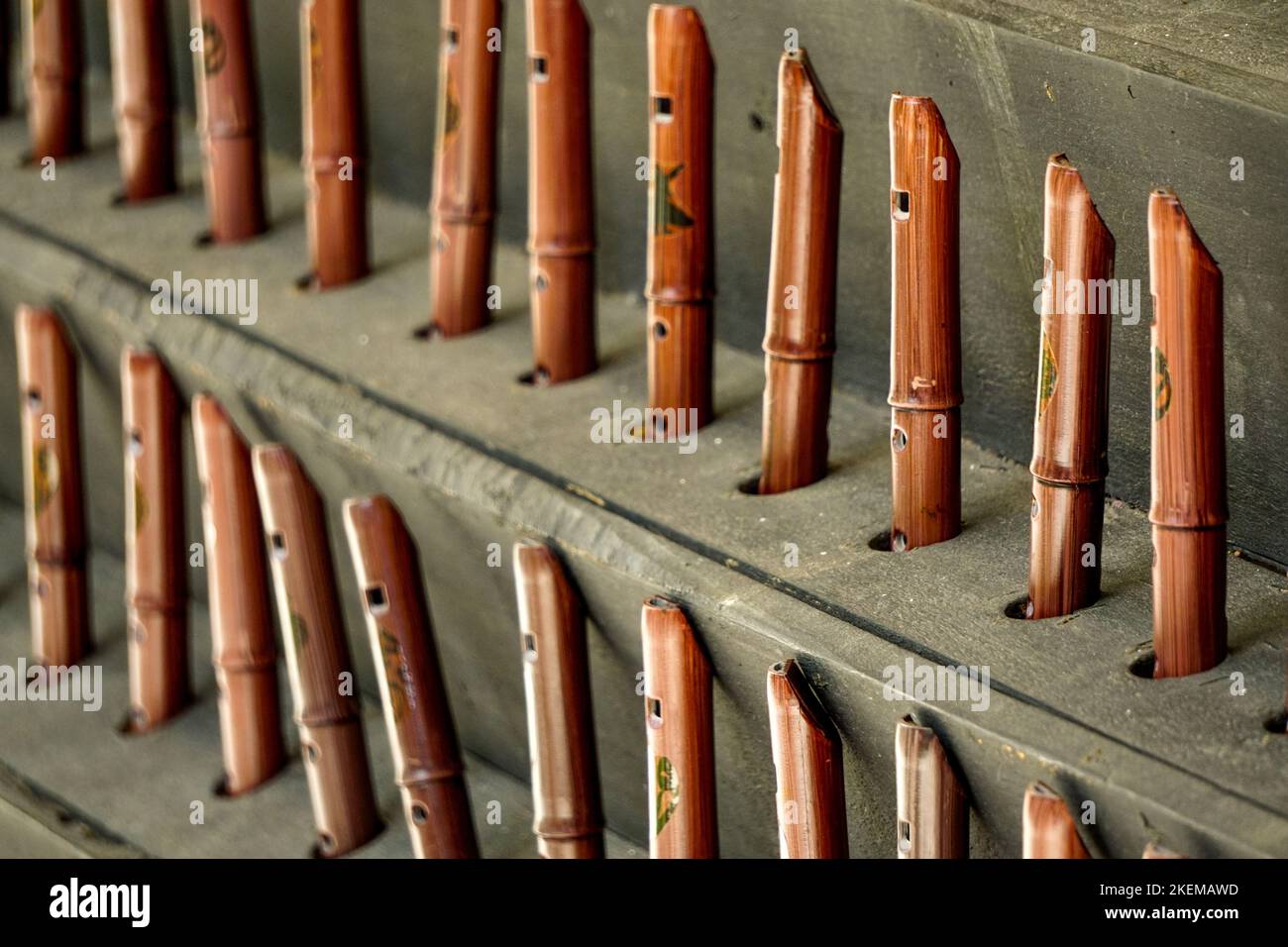 A display of end blown reed flutes in a musical instruments shop at