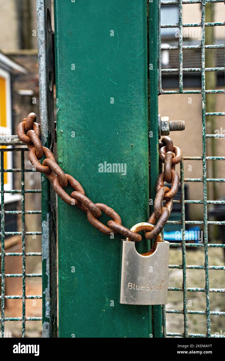 Metal gates secured by padlock Stock Photo Alamy
