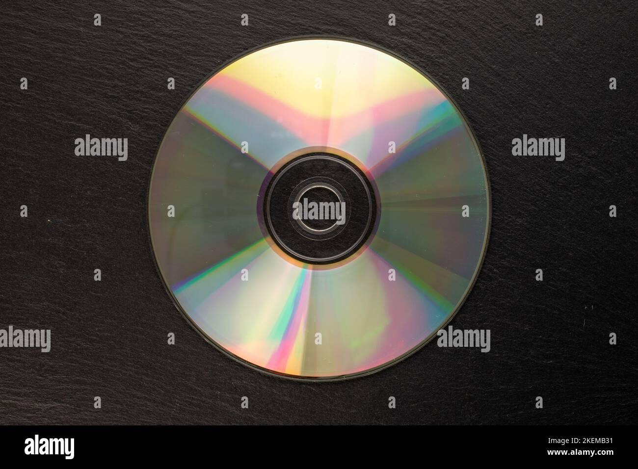 One CDR disc on slate stone, macro, top view Stock Photo Alamy