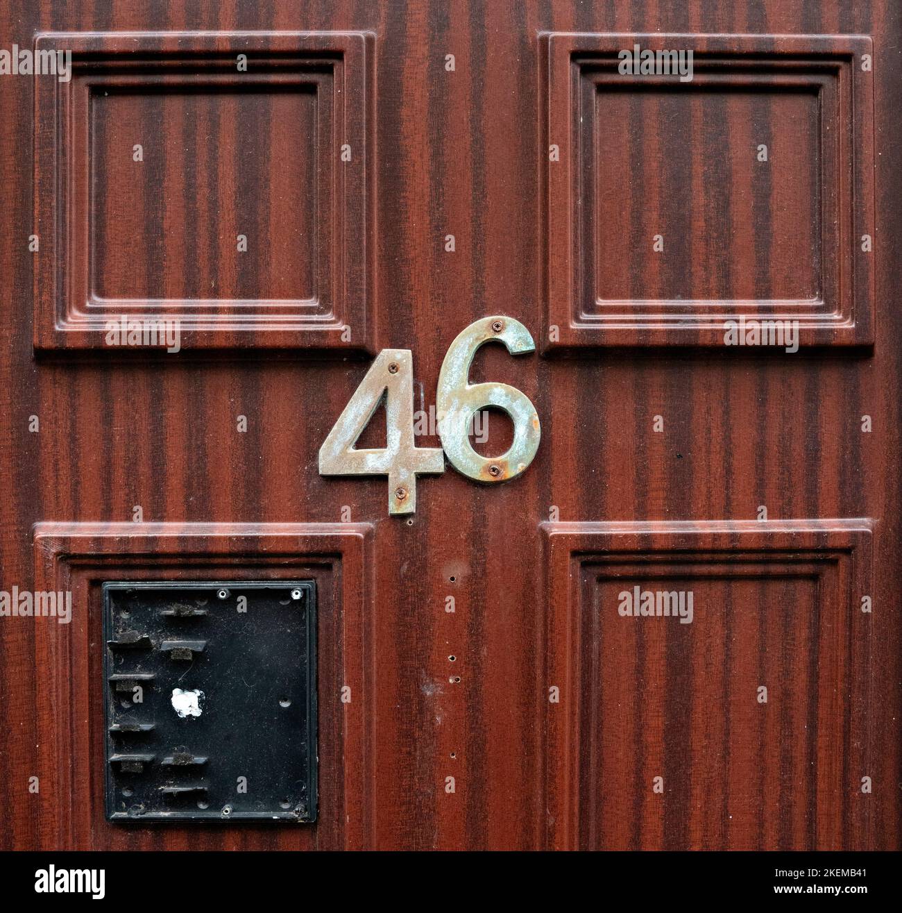 Front door of house number 46 Stock Photo