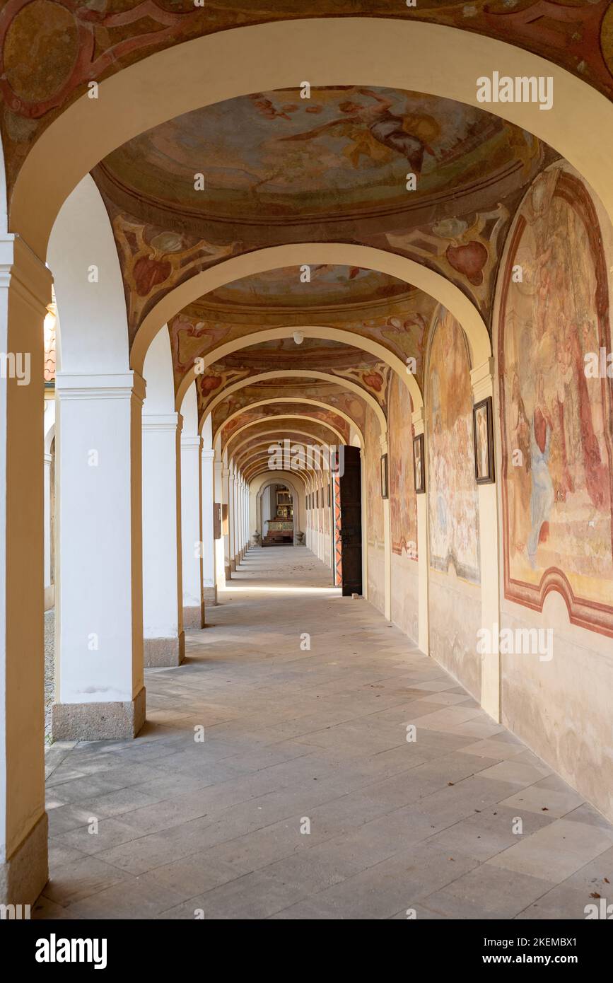 Shrine of Our Lady Victorious at Bílá hora in Prague, baroque church and monastery complex from 18th century. Cloister with religious frescoes. Stock Photo