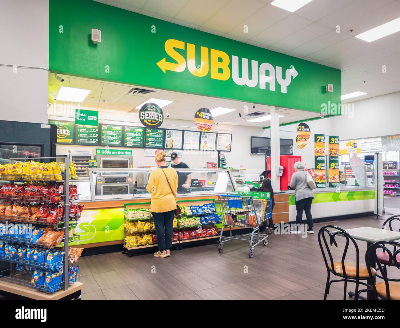 New Hartford, New York - Nov 3, 2022: Landscape View of Subway Restaurant Interior with Customers Buying Food. Stock Photo