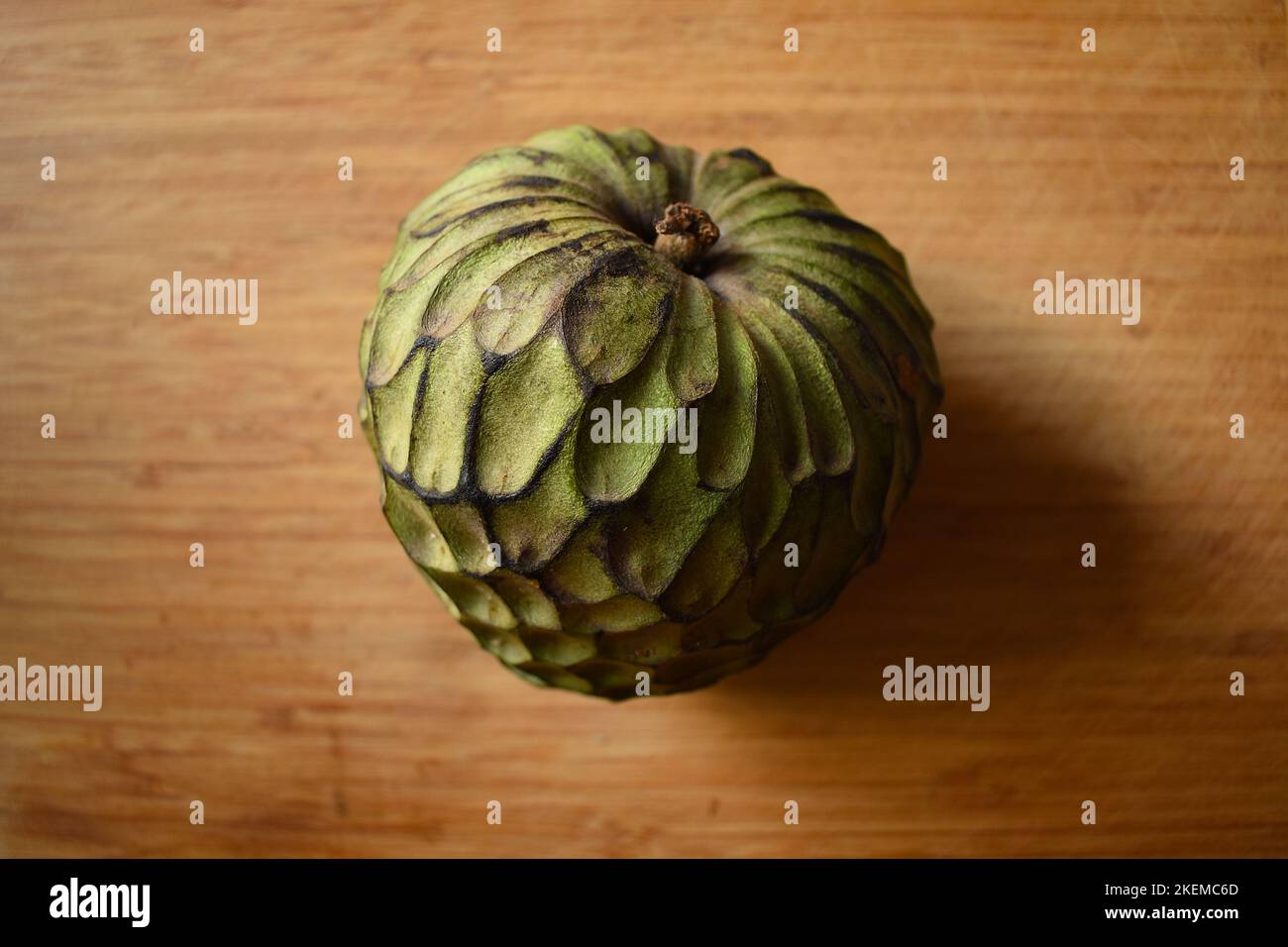 Custard apple on a chopping board Stock Photo