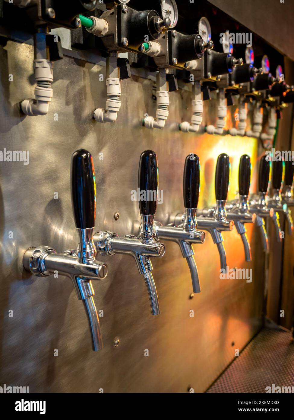 Row of beer tap lines for cold draft beer in pub and restaurant. Craft
