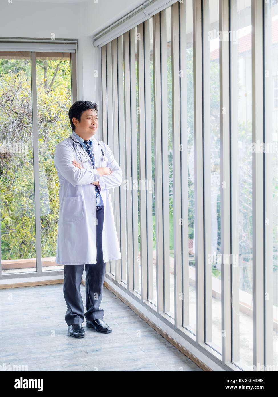 Happy asian male physician hi-res stock photography and images - Alamy