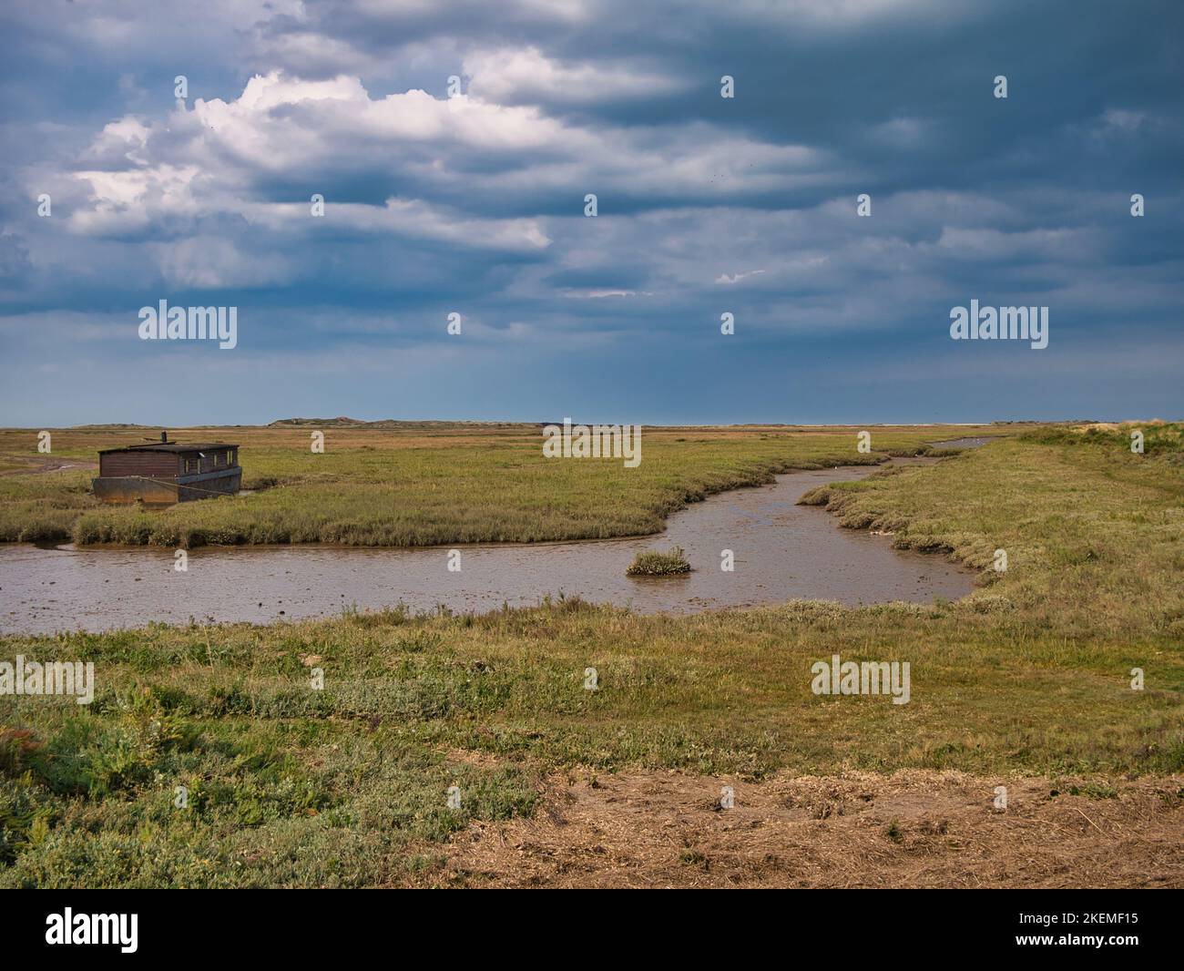 The North Norfolk coastal wetlands, in the east of the UK. Taken on a calm, sunny day in summer with a blue sky. Stock Photo