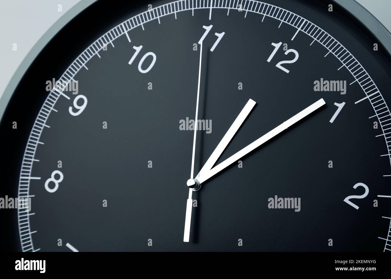 Close-up of hands on clock face Stock Photo