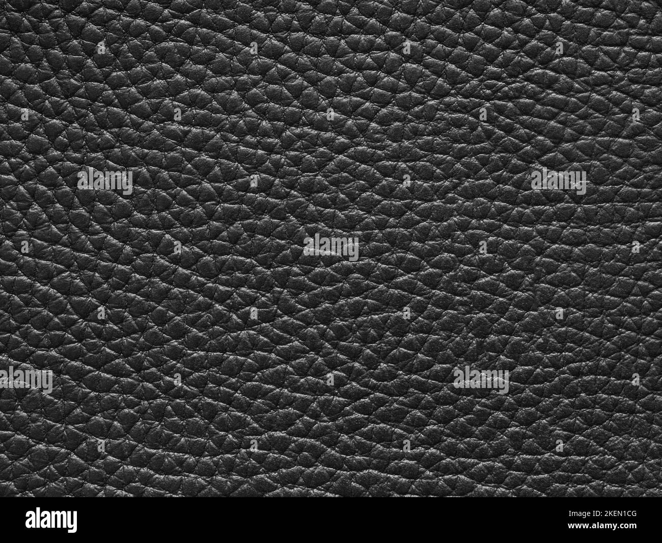 Genuine luxury black leather texture sample. Background with copy space, top view. Leather pattern in dark tone. Faux eco leather. Backdrop textured Stock Photo