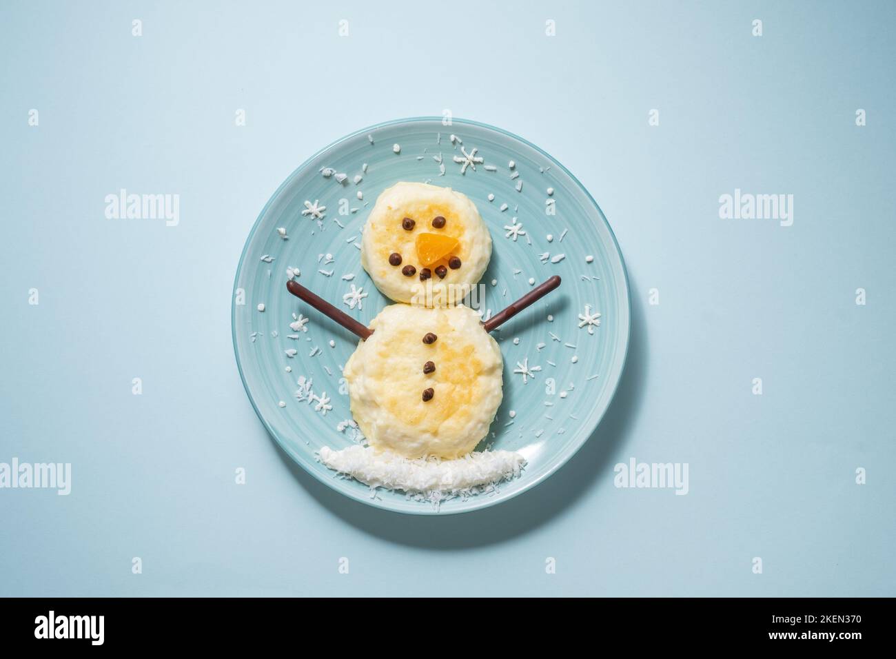 Funny snowman Christmas morning breakfast pancakes Stock Photo