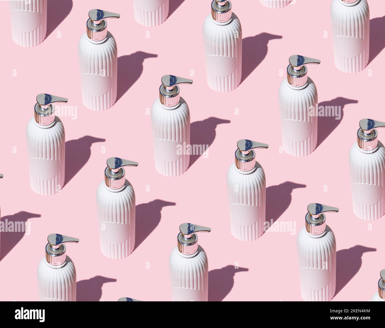 Cosmetic sprayer pattern on pink background Stock Photo