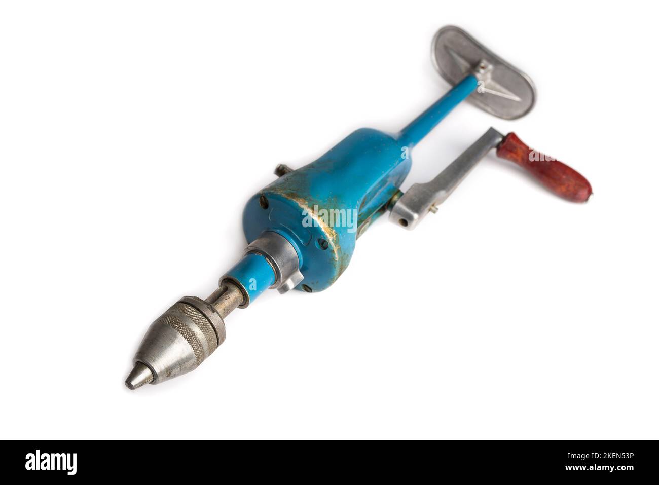 Retro drill on the crank on a white Stock Photo