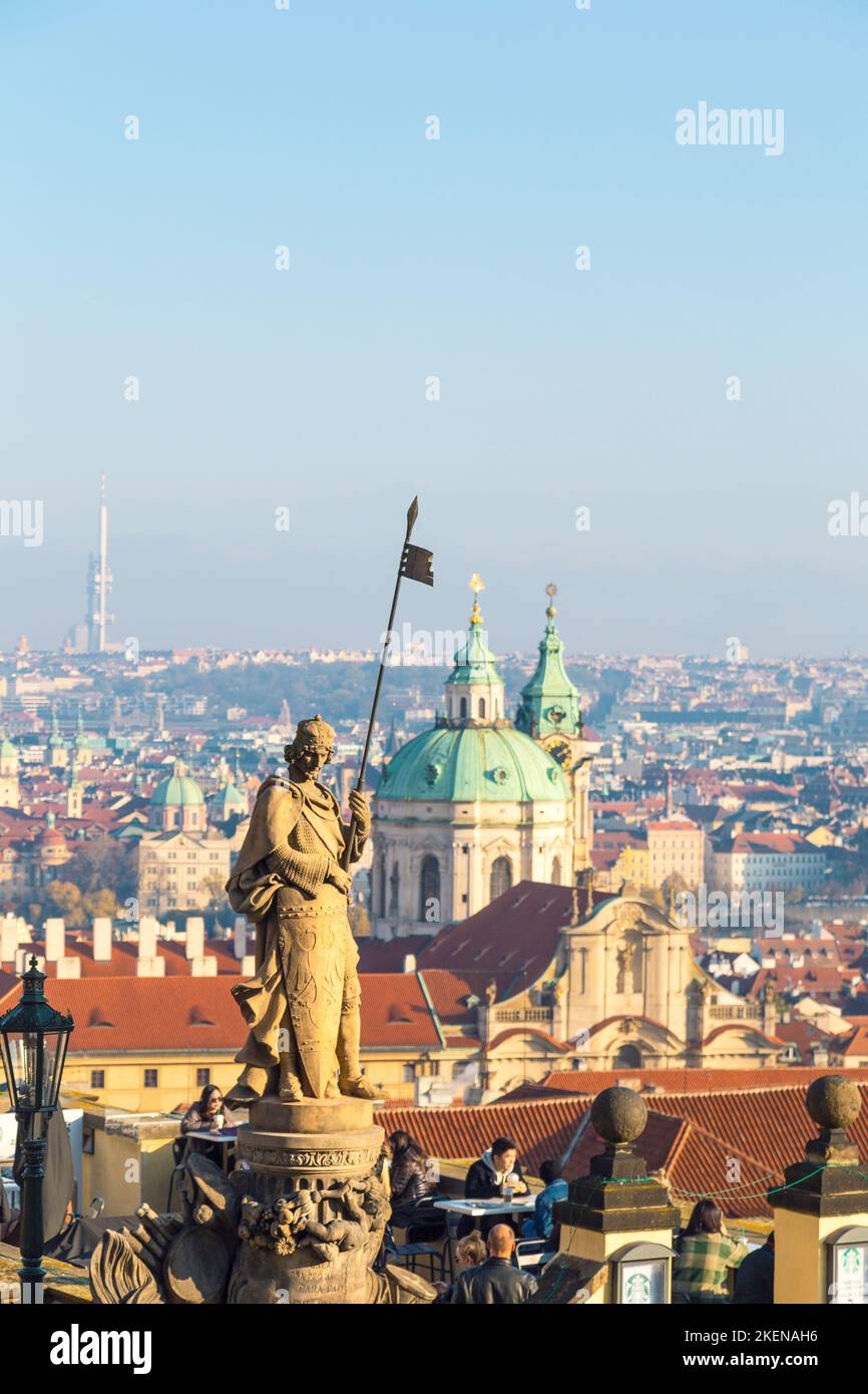 St. Wenceslas statue overlooks Prague city. Sculpture by Cenek Vosmik in Hradcany Square at Prague Castle. Saint with shield and spear against skyline Stock Photo