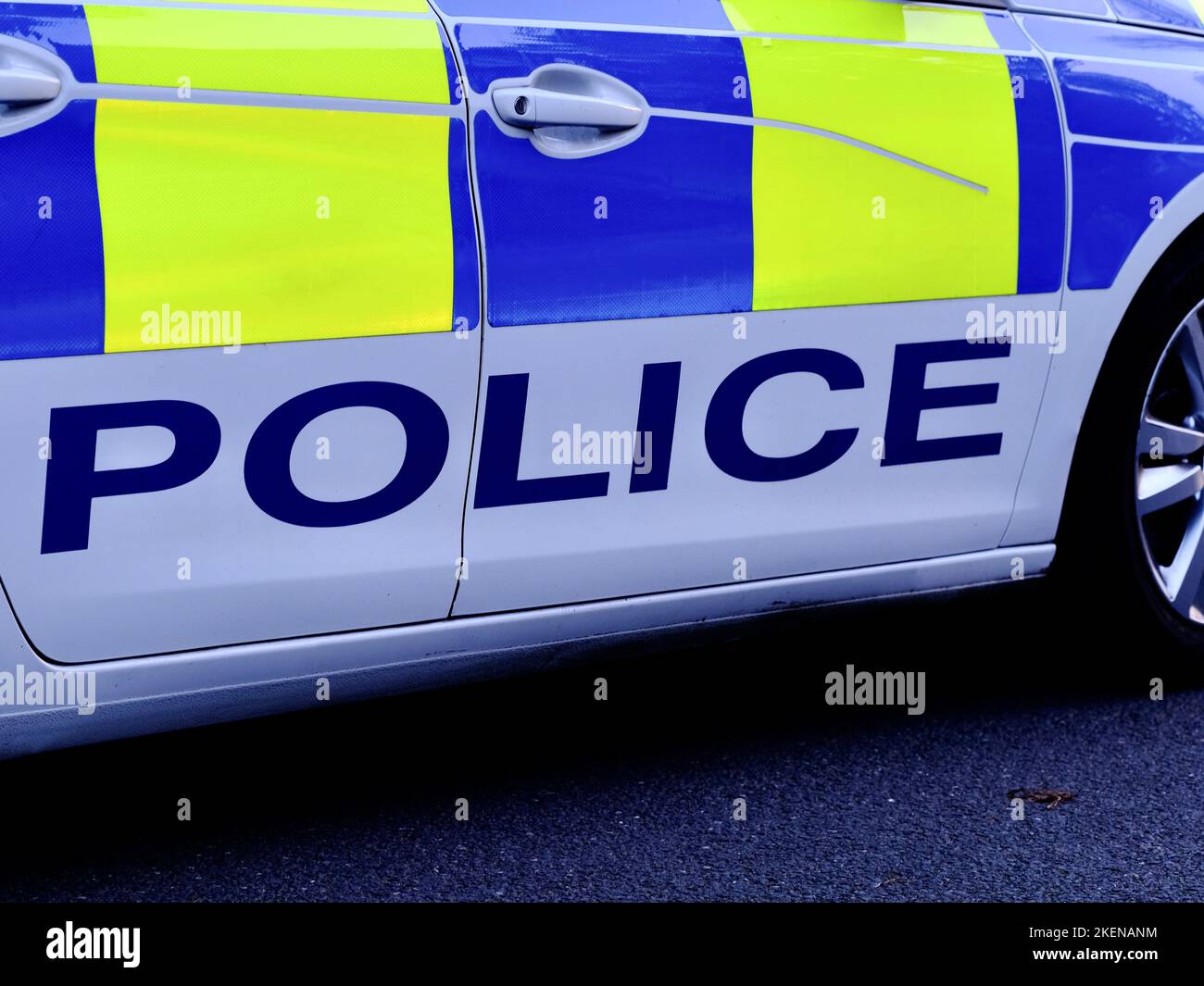 The world police on the side of a police car. Police force in the UK