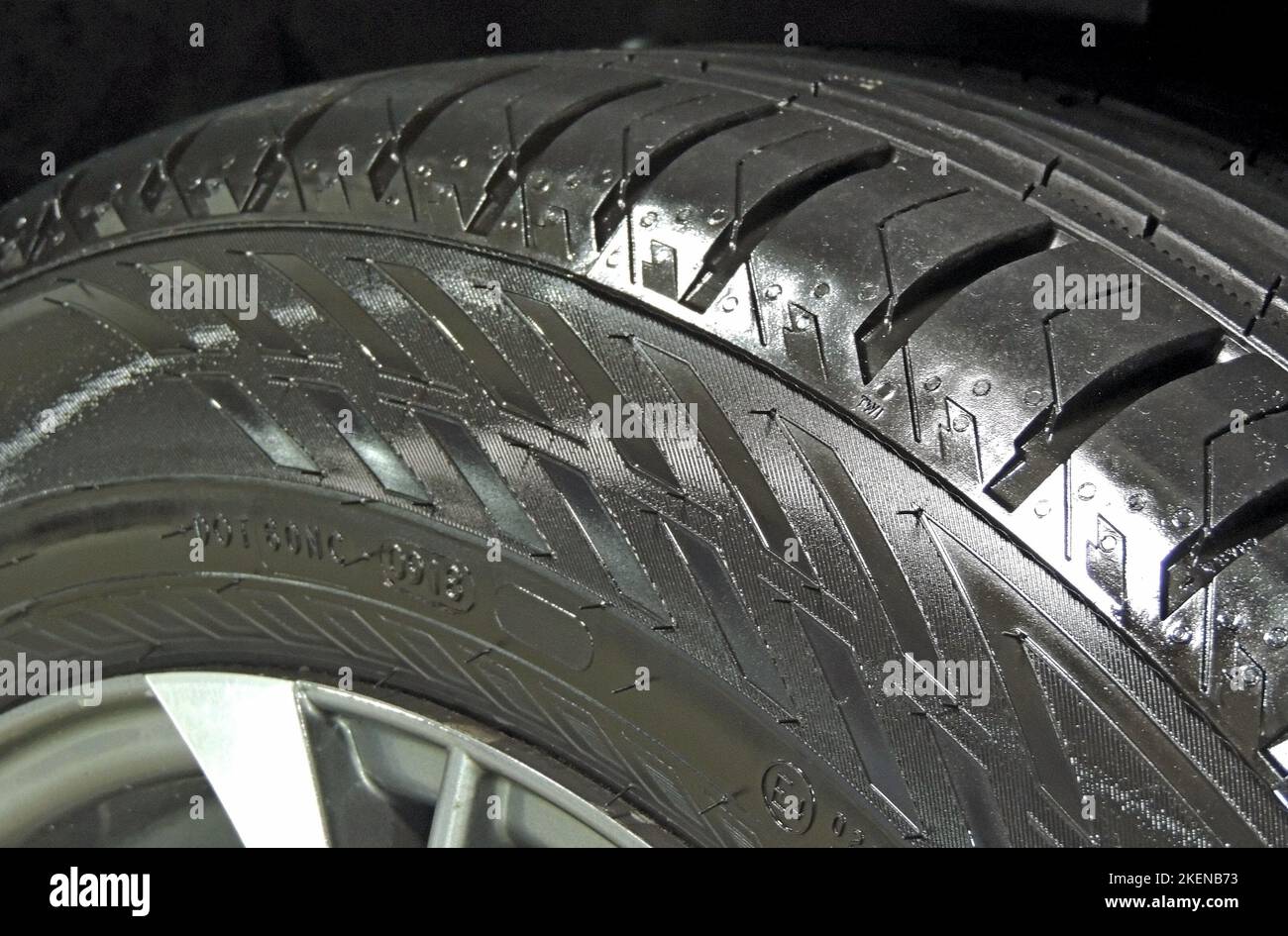 Polished sidewall of car tire on the alloy wheel rim close up Stock Photo