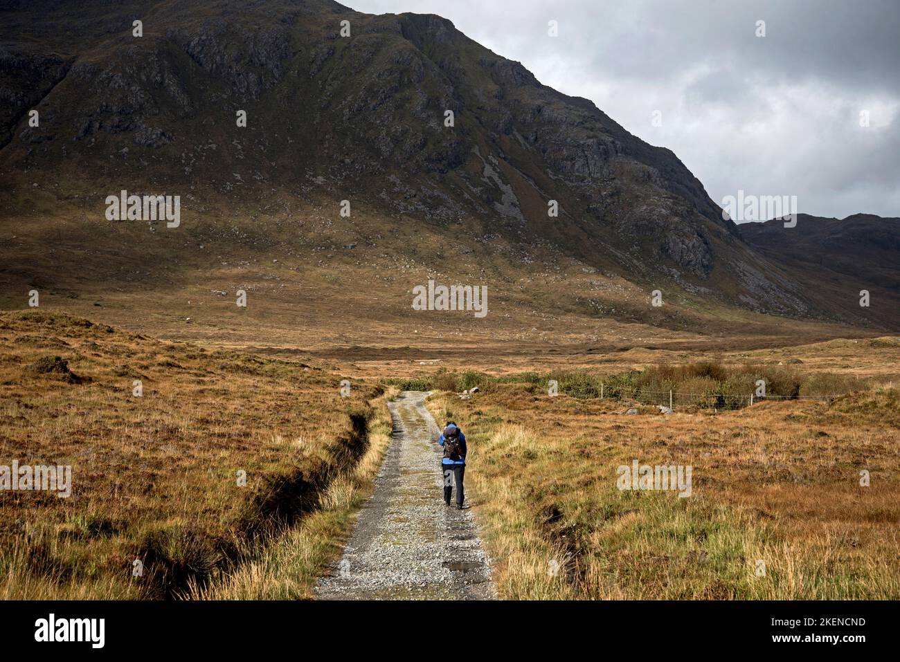Walker on the path to the North Harris Eagle Observatory in Glen Mevaig on the Isle of Harris in the Outer Hebrides, Scotland, UK. Stock Photo