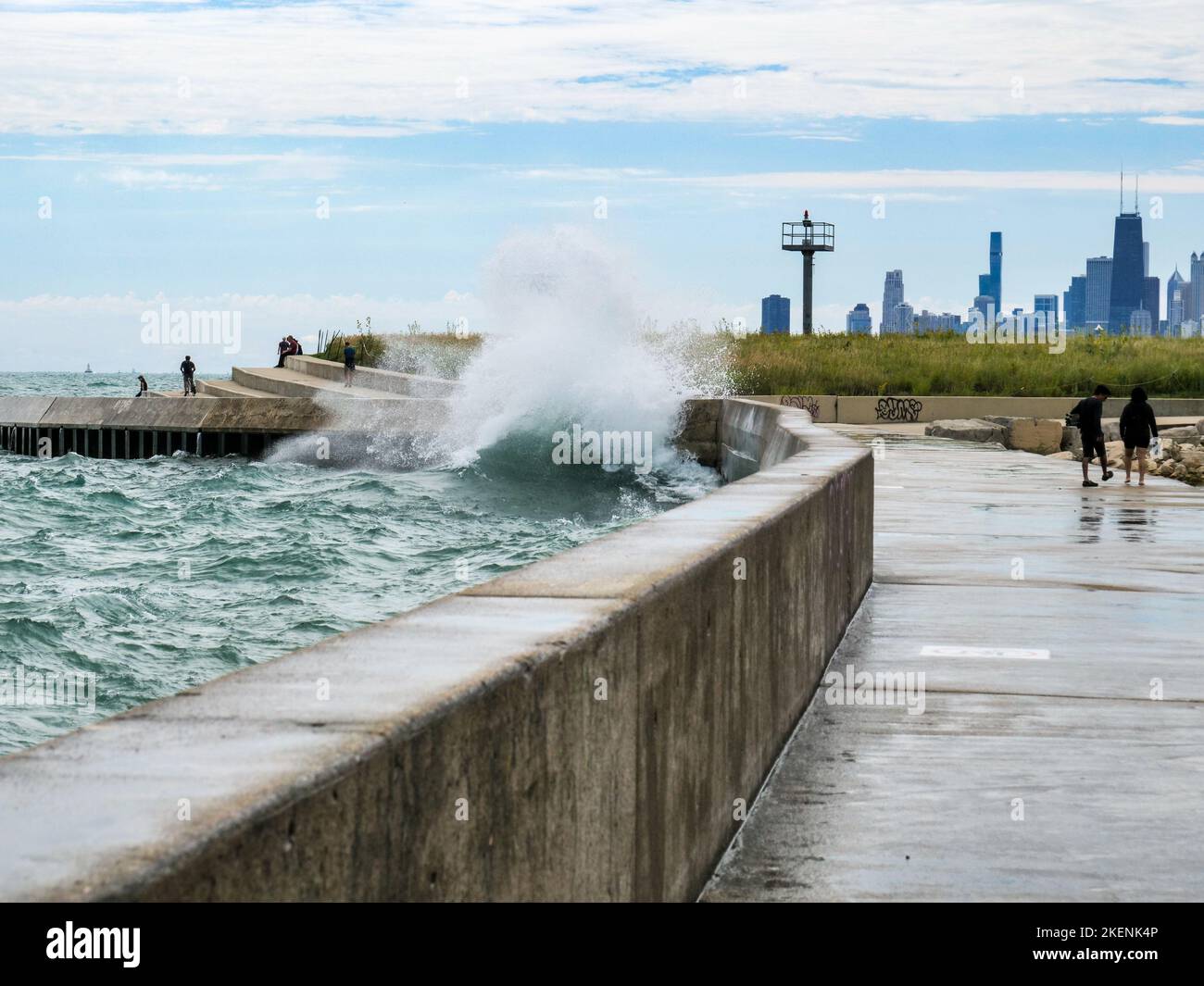 Waves crashing over the seawall at Montrose Point, Chicagio, Illinois. Stock Photo