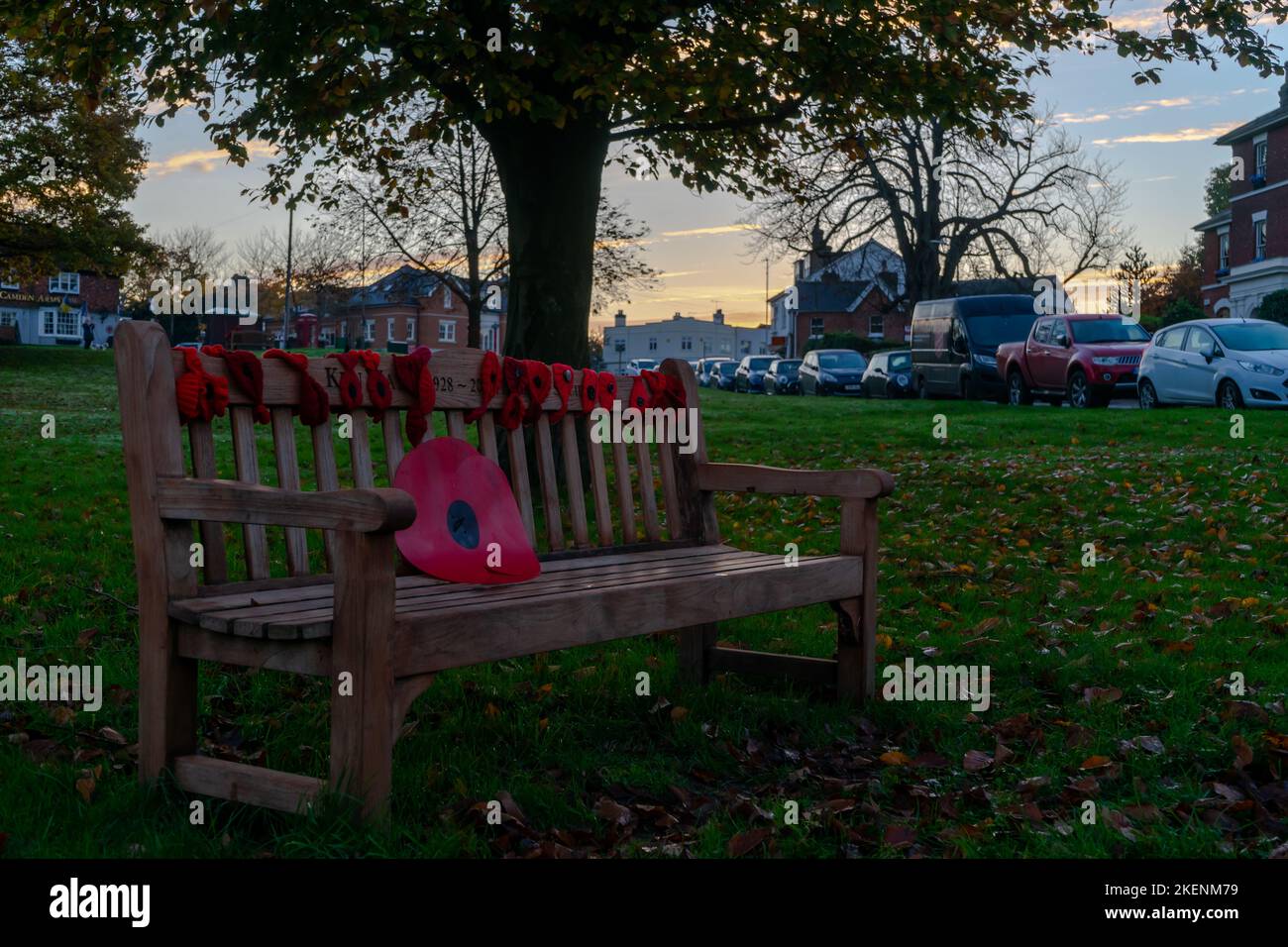 Pembury, Tunbridge Wells, Kent, England. 13 November 2022. Remembrance Day is marked by a collection of poppies and silhouettes of fallen soldiers on Pembury Village Green, shot at dusk  ©Sarah Mott / Alamy Live News. Stock Photo