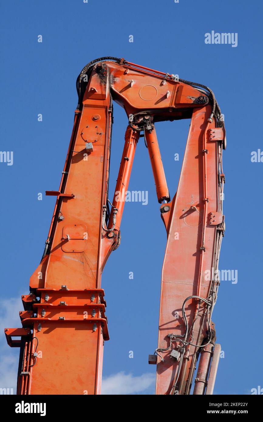 Orange hydraulic excavator arm of an excavator on a construction site, Germany Stock Photo Alamy