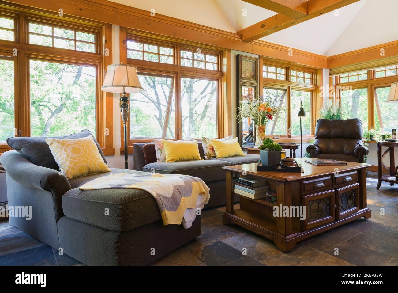 Sectional sofa and antique wooden coffee table in the new extension