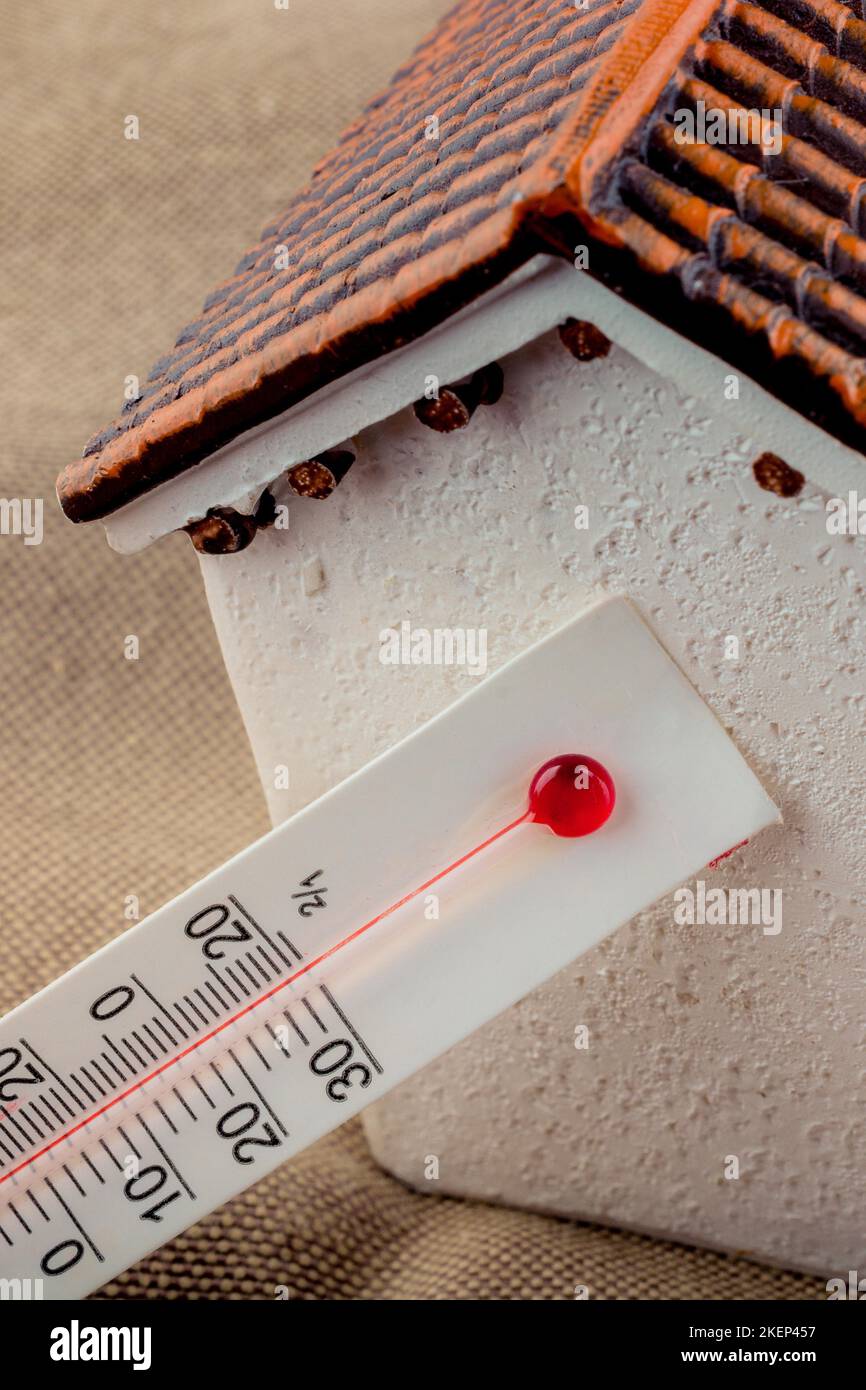 https://c8.alamy.com/comp/2KEP457/thermometer-measuring-temperature-by-a-little-model-house-2KEP457.jpg