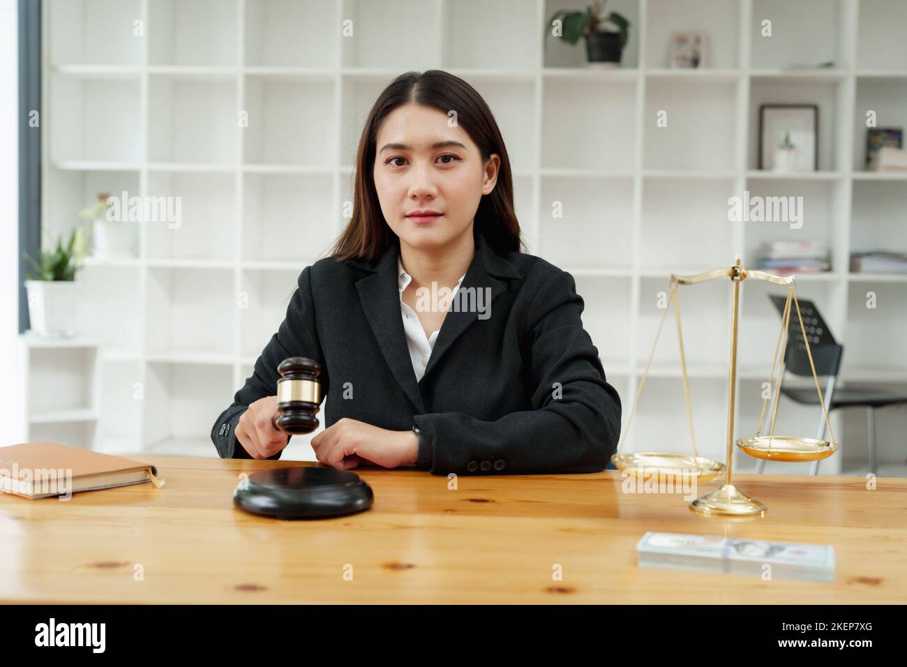 Corruption concept, law, female lawyer holding a gavel showing justice during work Stock Photo