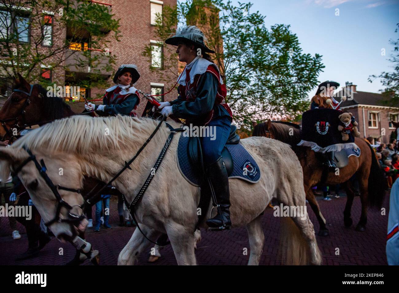 Some St Nicholas' helpers are seen riding horses while wearing