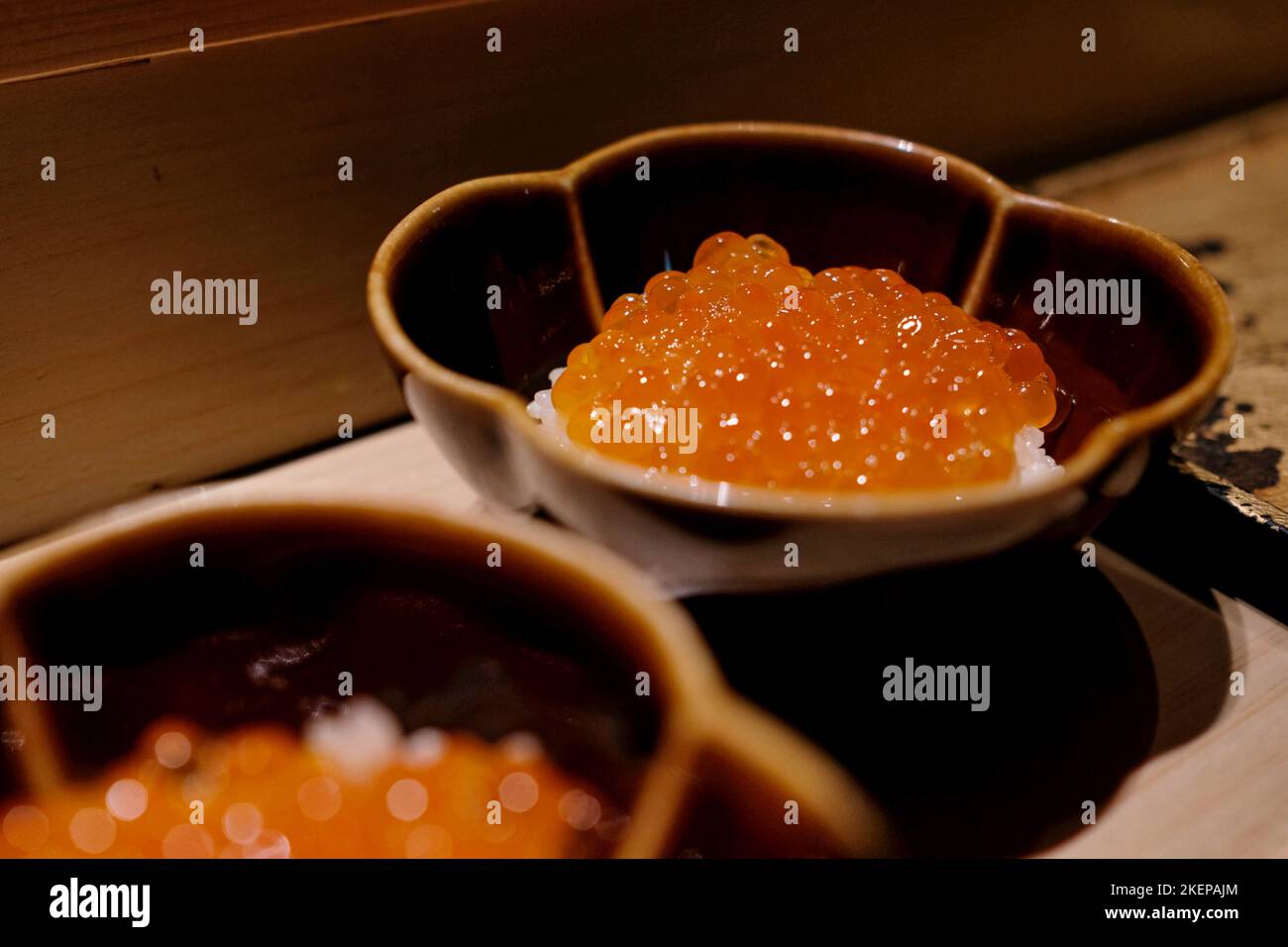 A small bowl of ikura don (salmon roe with koshihikari rice) at Manten, a modern omakase