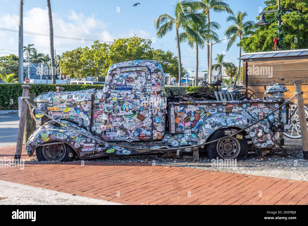 Antique Bumper Sticker Truck parked in Key West Florida Giving tourists