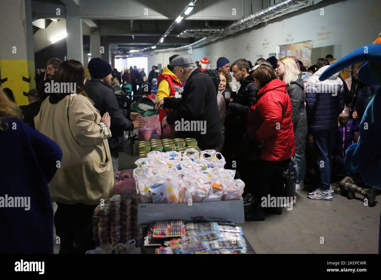 Internally displaced persons with their children seen in a queue to receive food parcels during the displaced persons support Day. A day of support for Internally Displaced Persons, IDPs took place in the parking lot of the Chernomorets stadium. The organizer is the 'Trimai' Charitable Foundation. The program includes the issuance of food packages to displaced persons, the collection of funds for the needs of the Armed Forces of Ukraine, the collection of food for feeding abandoned animals, a concert of a brass band 'Municipal Concert Band'. (Photo by Viacheslav Onyshchenko/SOPA Images/Sipa Stock Photo