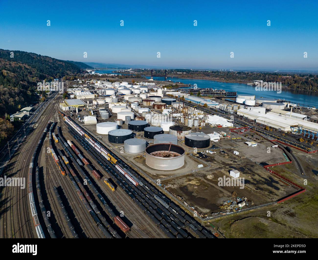 Petroleum and chemical tank farms along a busy rail yard on the