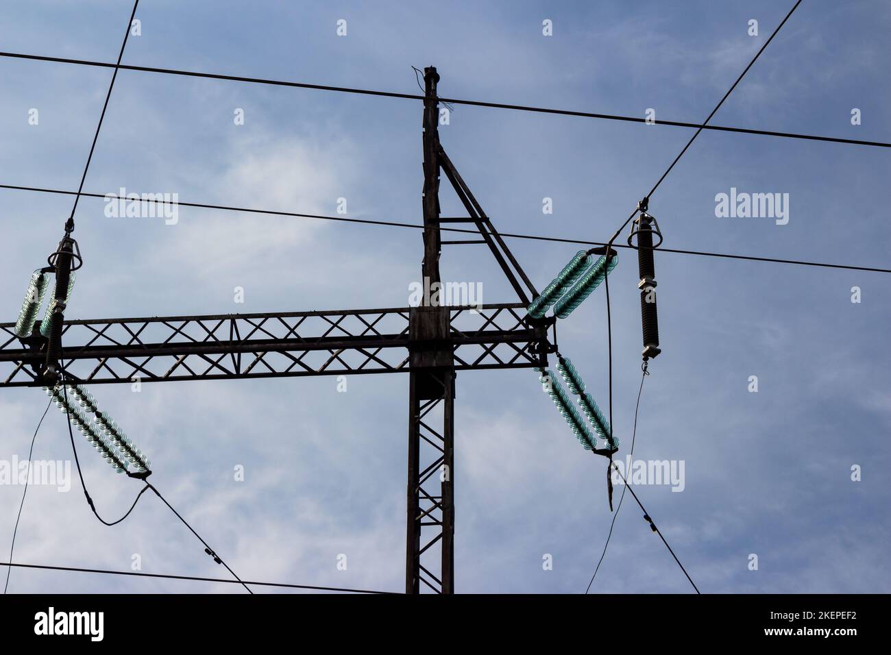 Insulators and wires on a high voltage power line pylon Stock Photo - Alamy