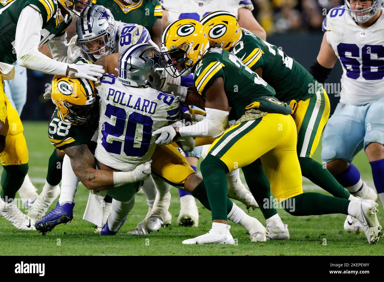 Green Bay Packers linebacker Isaiah McDuffie (58) picks up a loose ball  during an NFL football game against the Washington Commanders, Sunday, October  23, 2022 in Landover. (AP Photo/Daniel Kucin Jr Stock