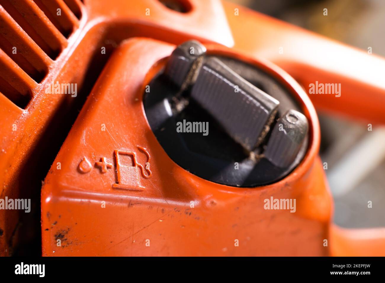 Tank for filling the fuel mixture with oil in the chainsaw. Gas station