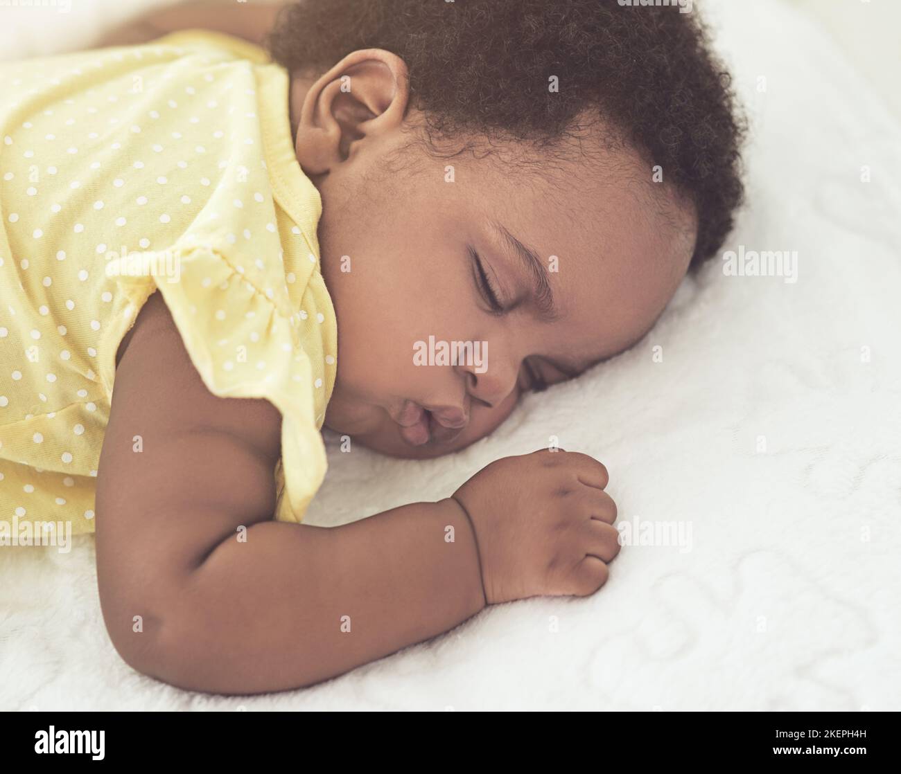 Black baby sleeping on bed hi-res stock photography and images - Alamy