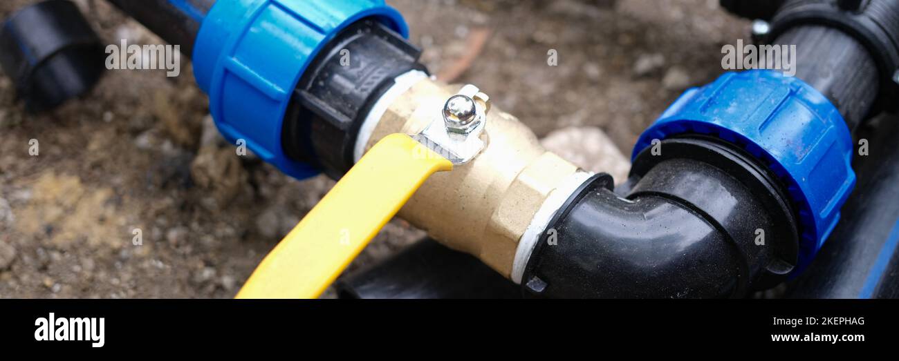 Water pipe connector with faucet closeup for watering plants in garden