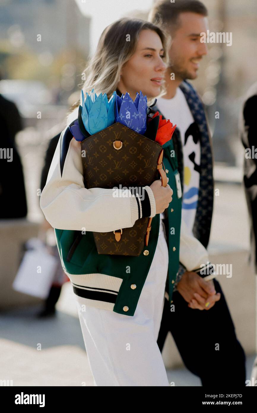 Street style, Thao Nhile arriving at Louis Vuitton Spring Summer 2023 show,  held at Musee du Louvre, Paris, France, on October 4, 2022. Photo by  Marie-Paola Bertrand-Hillion/ABACAPRESS.COM Stock Photo - Alamy