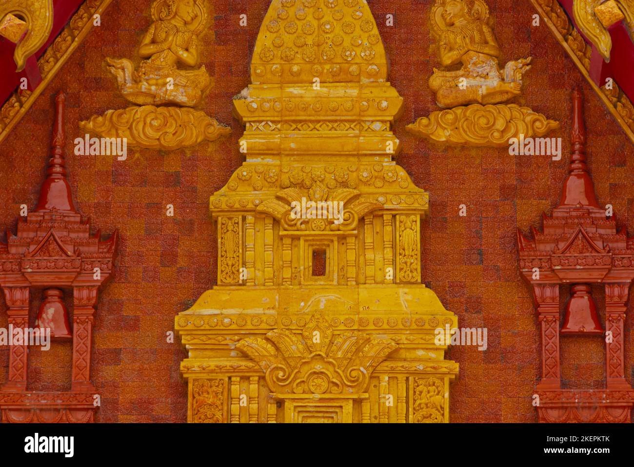 Temple architecture detail showing intricate carving and brown and gold ...