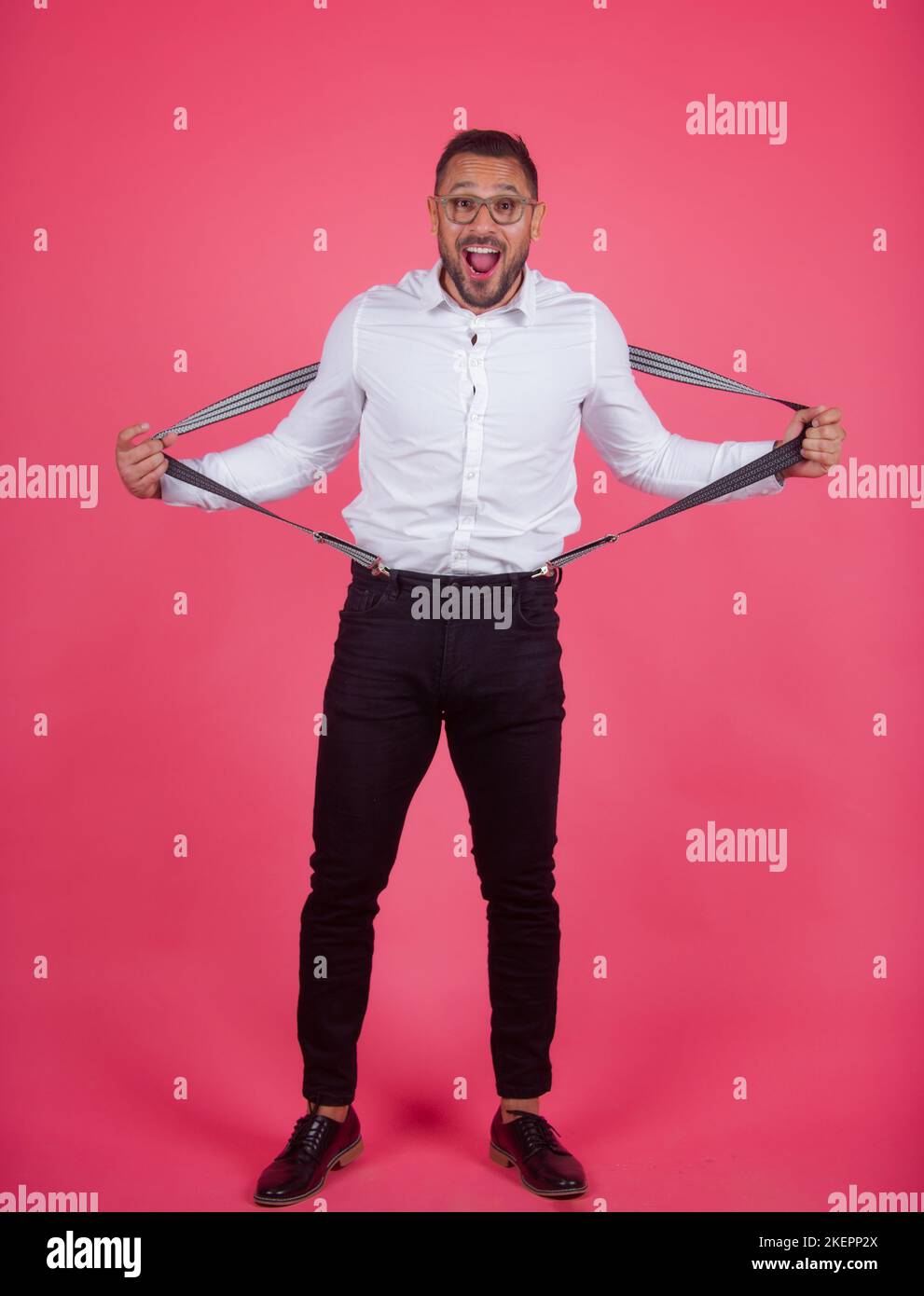 Shocked crazy man. Portrait of funny funky crazy man with suspenders