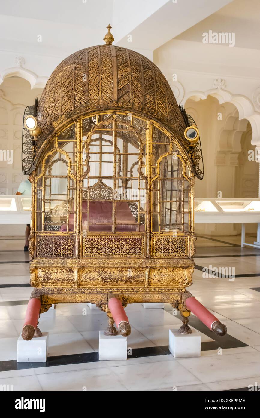 antique golden palanquin kept at fort from different angle shot is