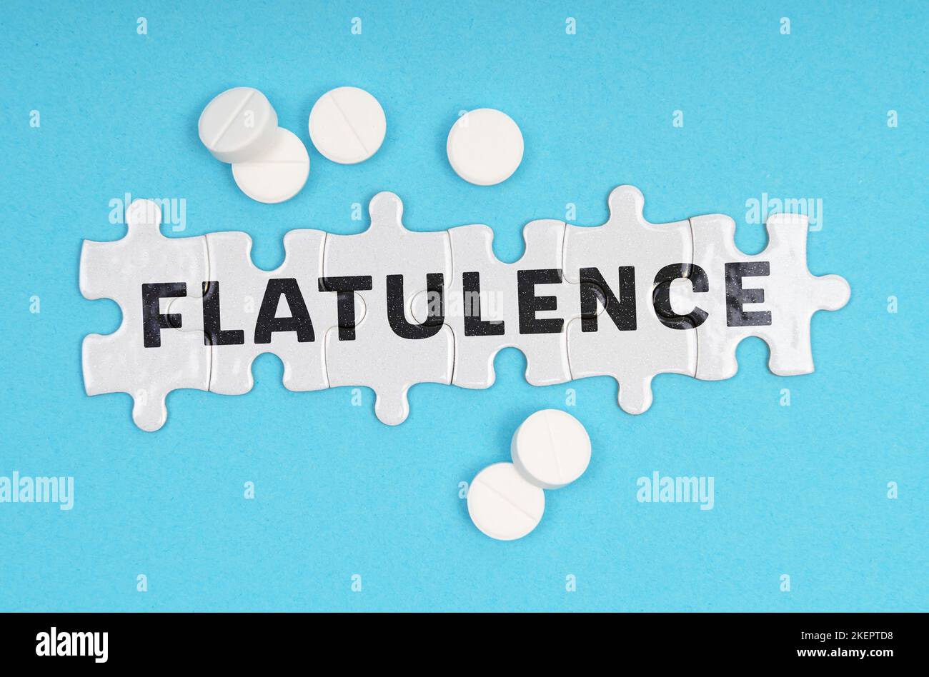 Medicine concept. On a blue background pills and puzzles with the