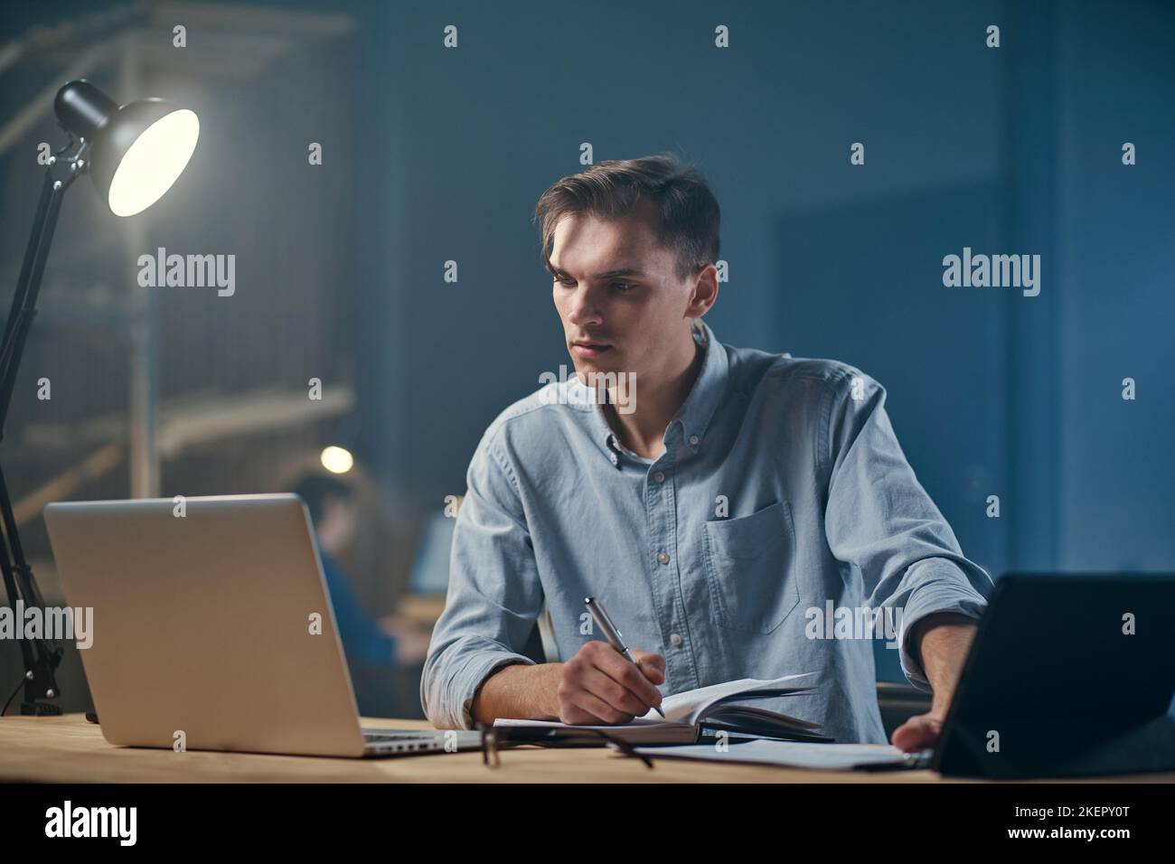 young businessman using a laptop while working on a new project . Stock Photo