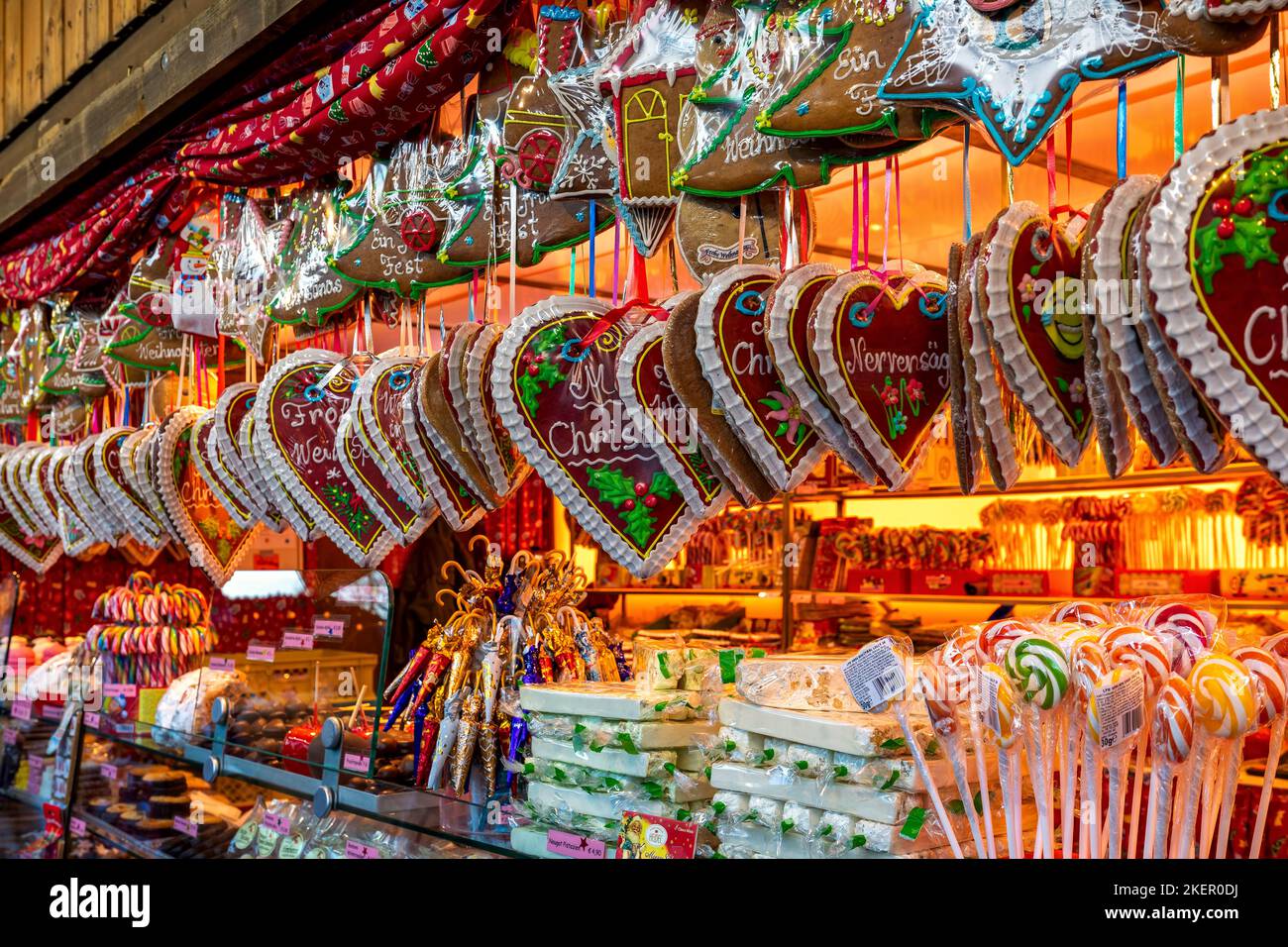 Heart-shaped gingerbread cookies and other traditional sweets on sale at famous Christmas market in Vienna, Austria. Stock Photo