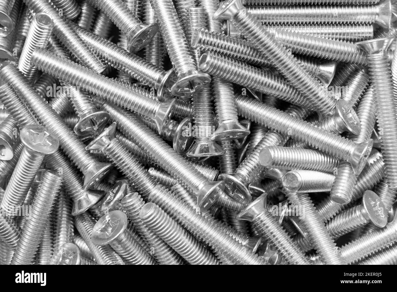 Metal bolts a row background. Chromed screw bolts texture. Steel bolts